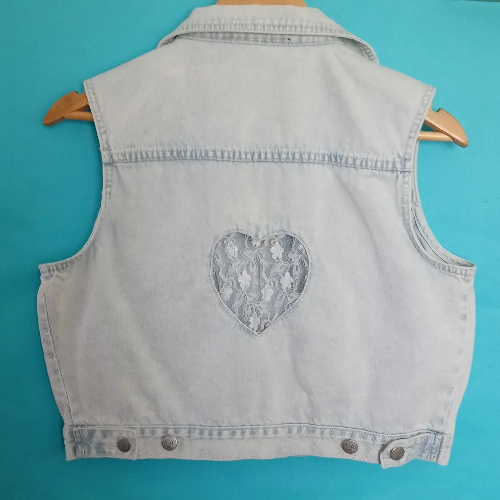 Vest L A . Blue  with a lace heart in the back  size  Large girls color light